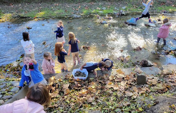 students in creek