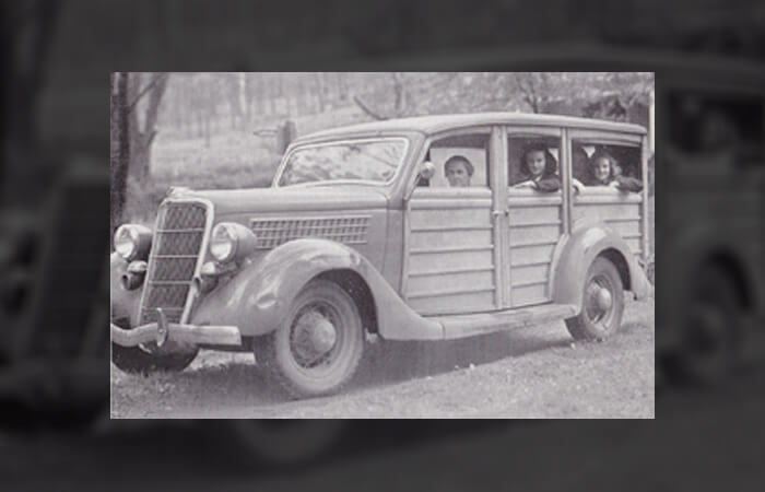 people in vintage car